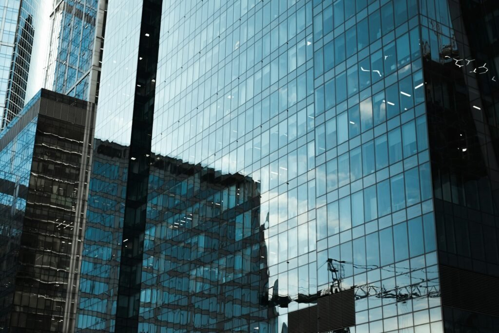 Skyscraper close-up. High rise glass building exterior. Modern office building, business center